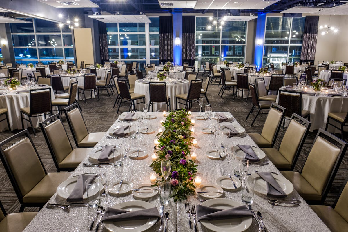 a room filled with furniture and vase of flowers on a table